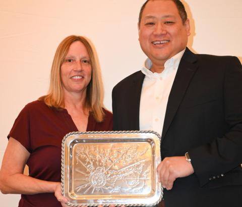 Jonathan Young, right, Aphena Easton vice president and general manager, and Melissa Patchett, director of operations, accept the Talbot County Community Impact Award on behalf of Aphena Pharma Solutions.